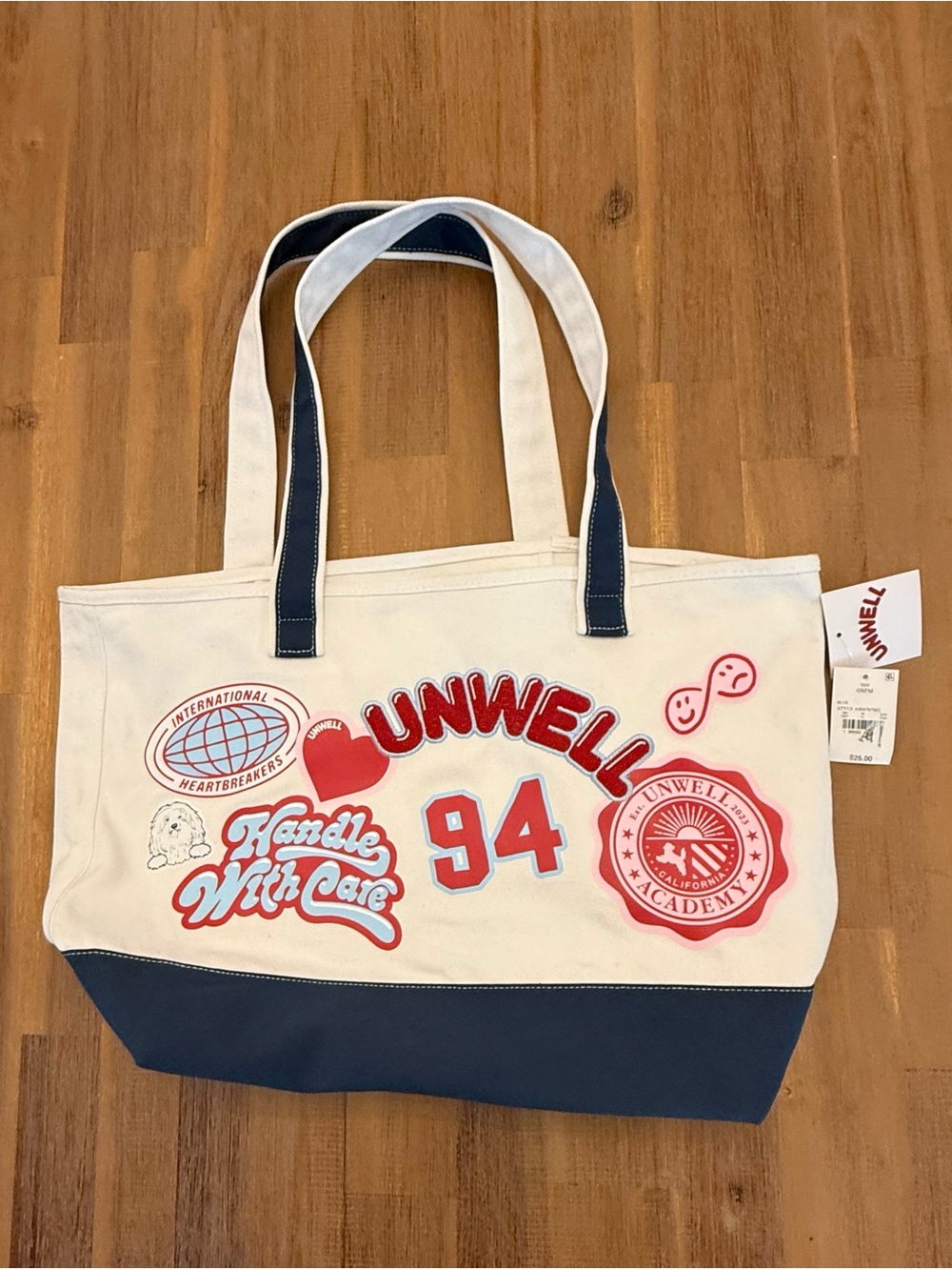 Unwell Canvas Tote Bag in Cream and Navy with Red accents